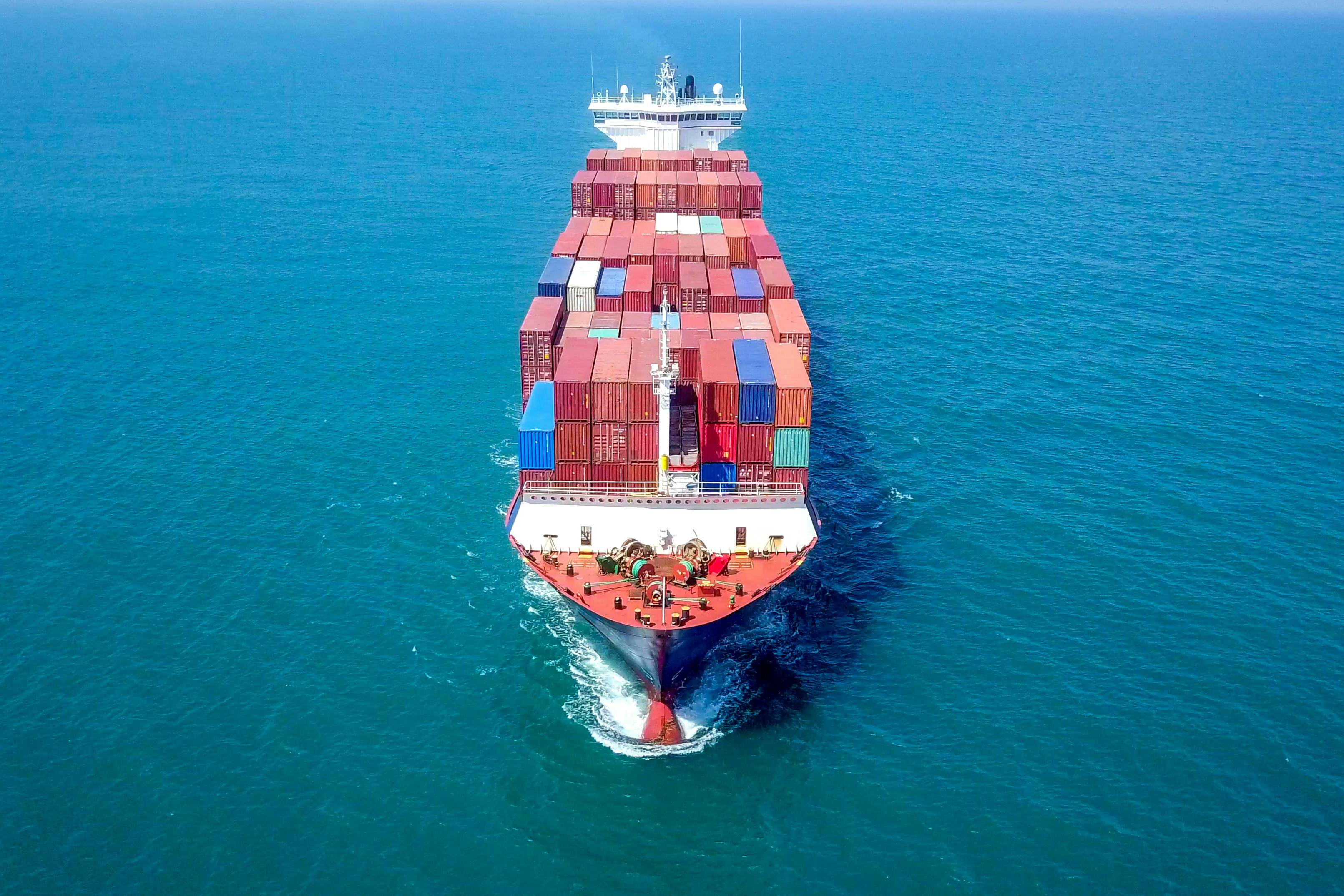 Container ship in blue sea