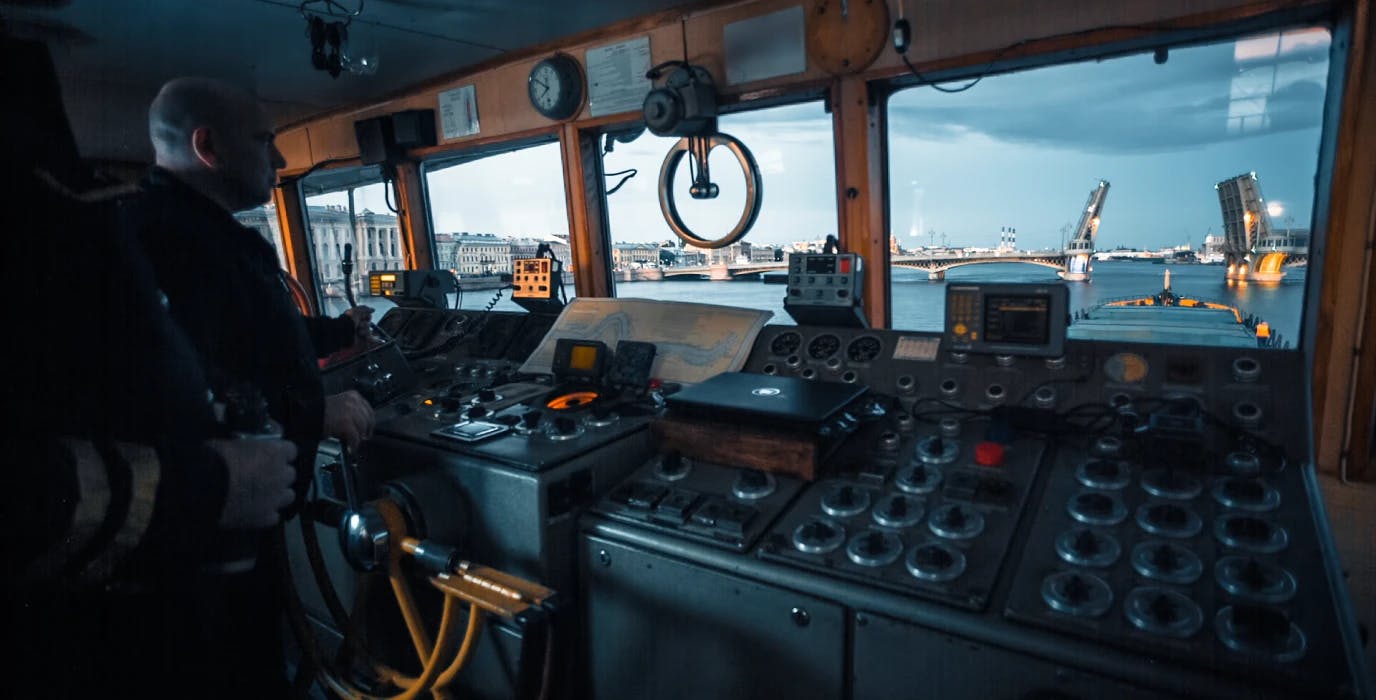 Captain standing at helm